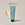 A tube of ACURE Ultra Hydrating Conditioner next to a circle displaying old branded packaging and text calling out: New look , same proven formula